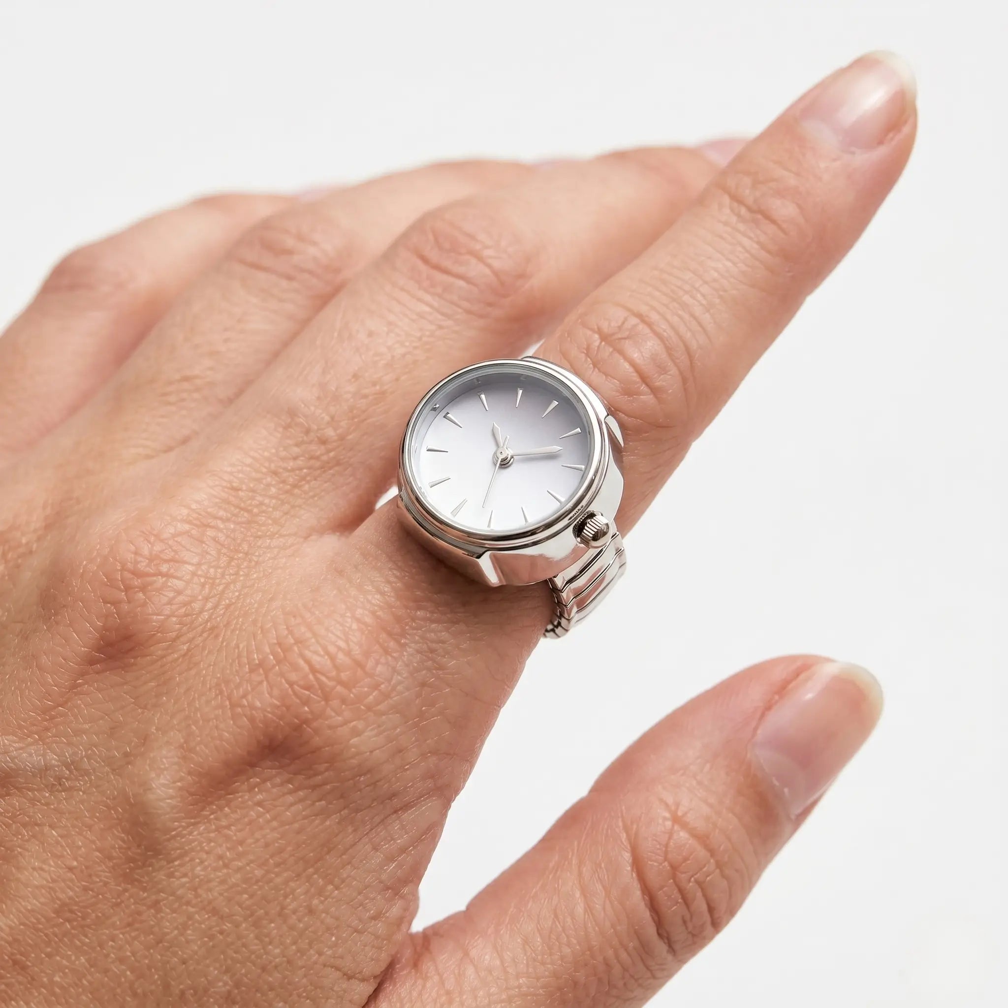 Close-up of a functional vintage ring watch worn on a woman's index finger Image