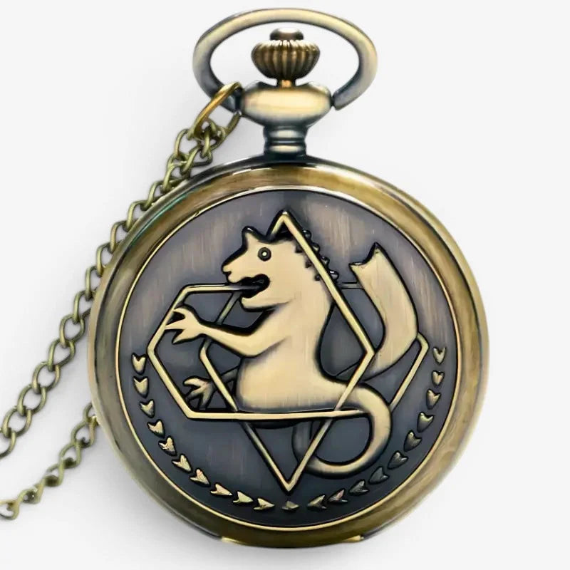 Antique brass-finished alchemist pocket watch with embossed mythical creature and heart motifs on the back side