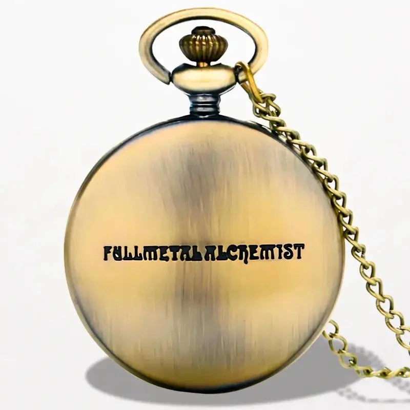 Antique brass-finished alchemist pocket watch with fullmetal alchemist engraved in black lettering on the case front