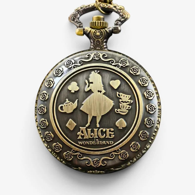 Antique brass-colored alice in wonderland pocket watch with engraved silhouette alice playing cards and teacups design
