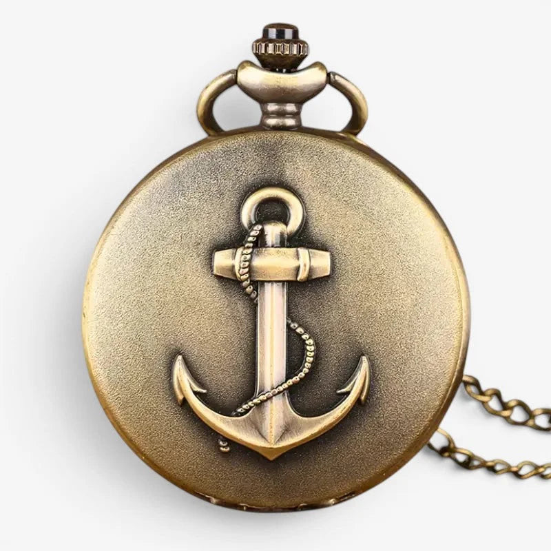 Antique brass anchor pocket watch with raised anchor design on face and matching chain for vintage style use
