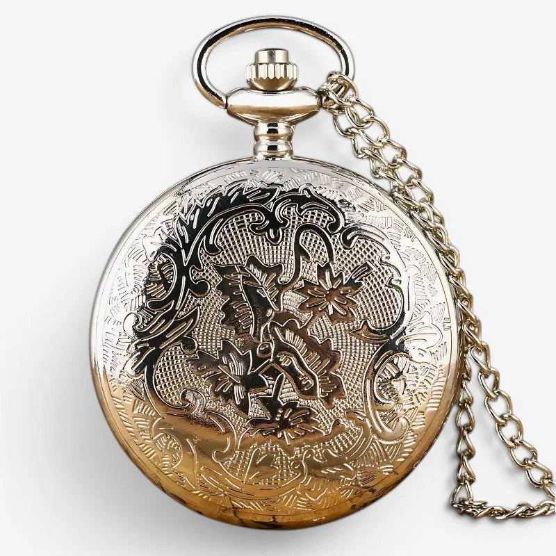 Antique-style silver-toned anchor pocket watch with intricate floral engraving gold-tone bottom half and chain