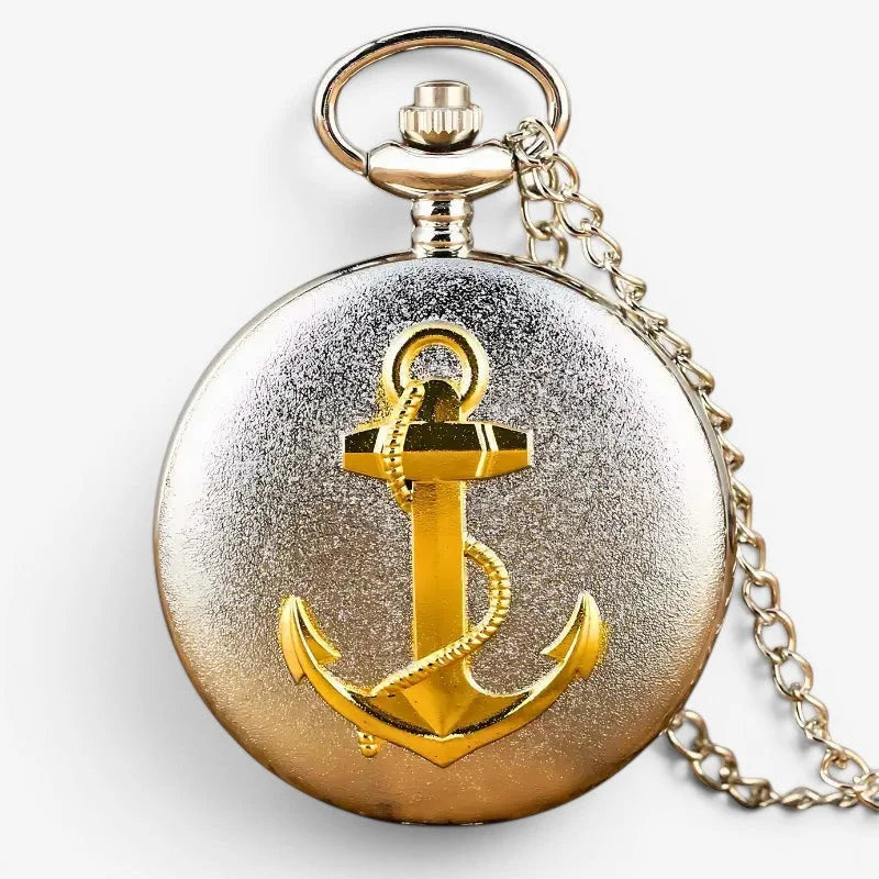 A gold-toned anchor emblem adorns a round two-tone silver and bronze anchor pocket watch with attached chain