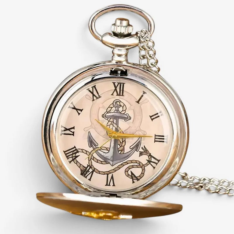 Silver anchor pocket watch with cream face roman numerals gold hands and chain for wearing nautical-themed design
