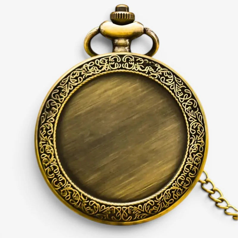 Antique bronze pocket watch in brass with intricate floral engraving around the bezel and matching chain