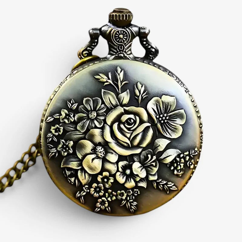 Antique floral decor pocket watch in brass with intricate floral engraving and a decorative chain