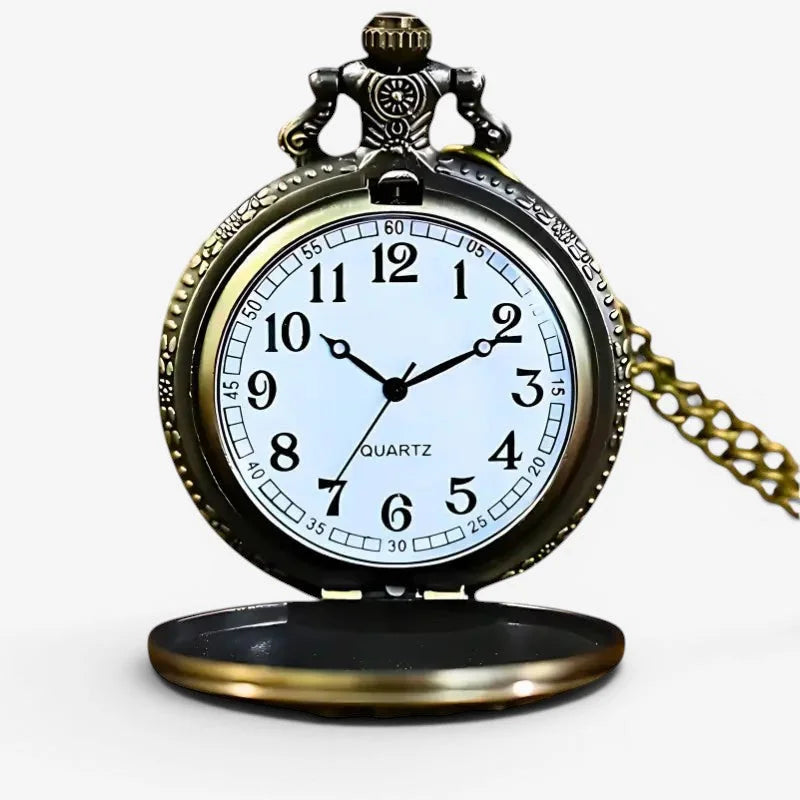 Antique floral decor pocket watch with brass case white face black numerals hands and ornate top finial