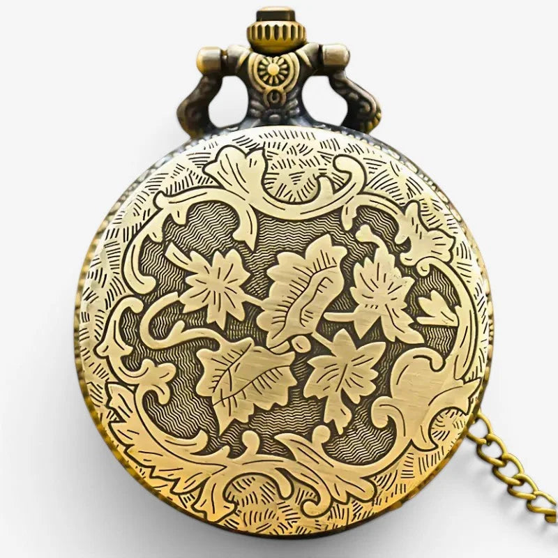 Antique flower pocket watch in brass with intricate floral engravings and a decorative crown detail