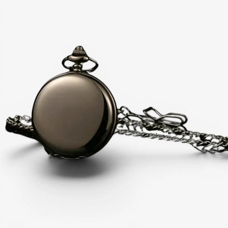 Antique mechanical pocket watch in black with a polished dark metallic finish and an attached chain