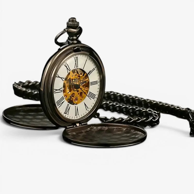 Antique mechanical pocket watch in black with visible golden gears roman numerals and a black braided chain