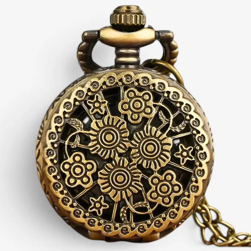 Antique pocket watch necklace in brass with intricate floral and gearwork engraving and decorative chain