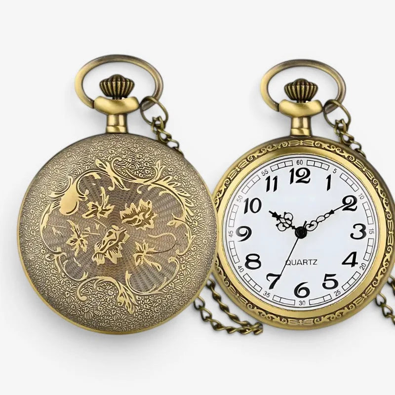 Antique roman numeral pocket watch with intricate floral brass engraving on back and white dial with black arabic numerals
