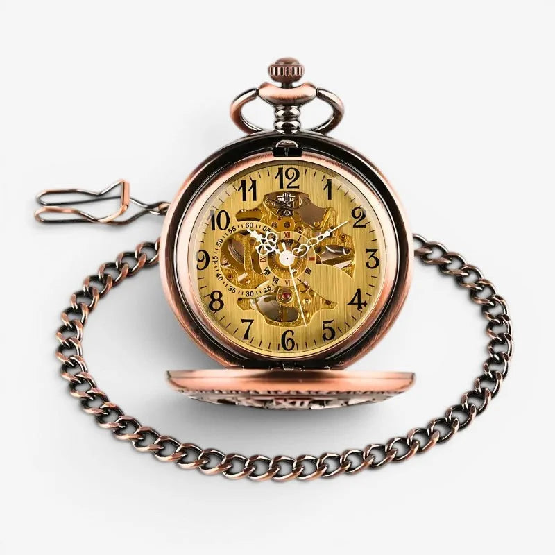 Antique rose gold pocket watch with bronze finish, visible golden skeleton movement, black arabic numerals, and ornate chain
