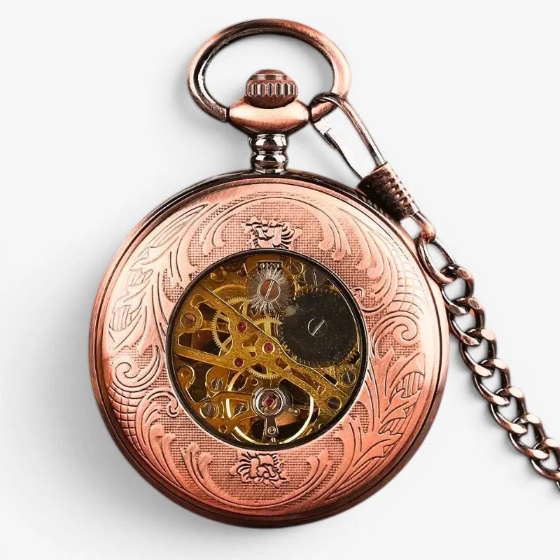 Antique rose gold pocket watch with copper finish floral engraving and visible golden gearwork movement