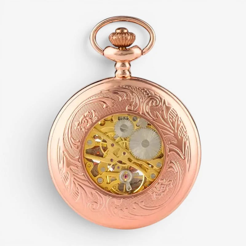 Antique rose gold skeleton pocket watch with intricate floral engraving and visible golden gears on front side