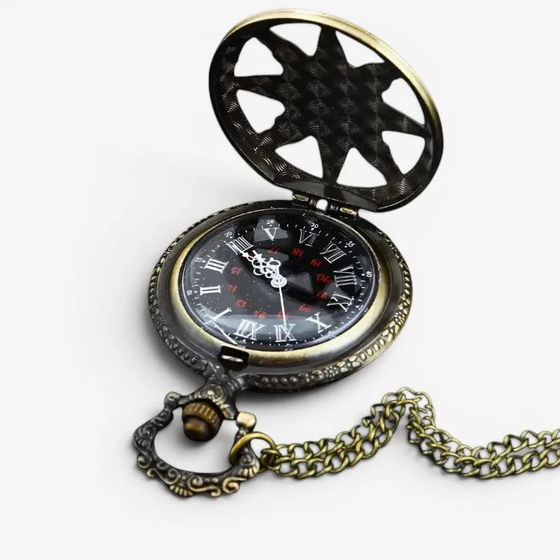 Antique stone pocket watch with ornate brass sunburst lid and black face featuring roman numerals