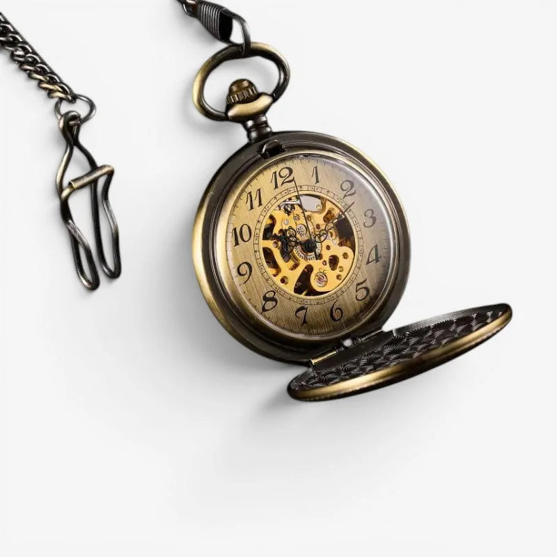Antique brass automatic pocket watch with visible mechanical movement and black arabic numerals on its face