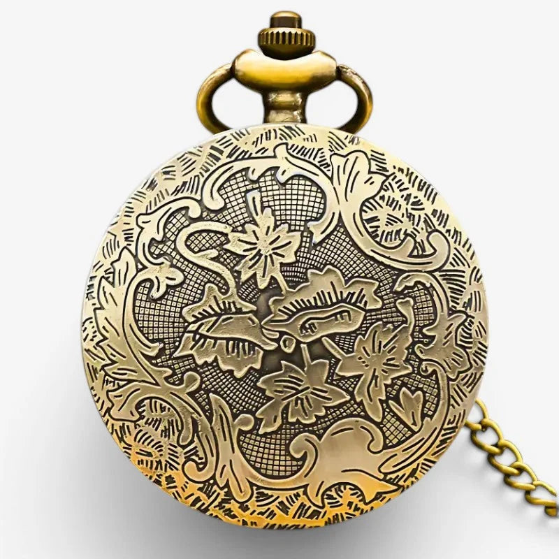 Antique brass bee pocket watch with intricate floral and vine engraving and decorative crown-shaped winding knob
