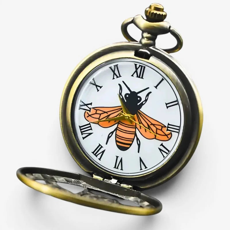 Antique brass bee pocket watch with white face black roman numerals and orange and black bee illustration at center