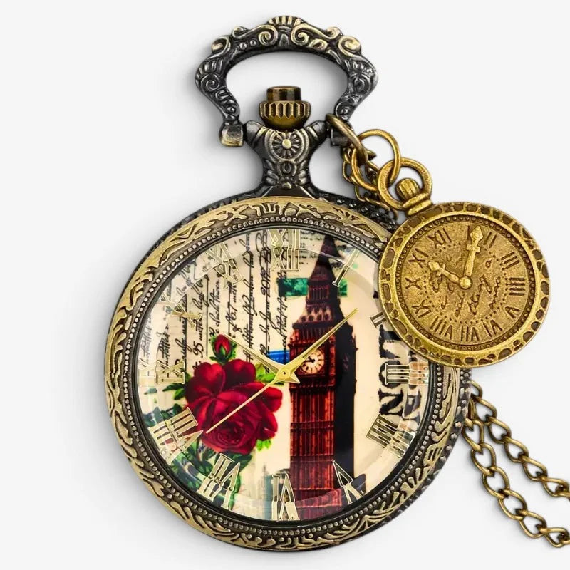 Antique-style brass Big Ben pocket watch with ornate silver-toned frame and decorative face featuring red roses and vintage script