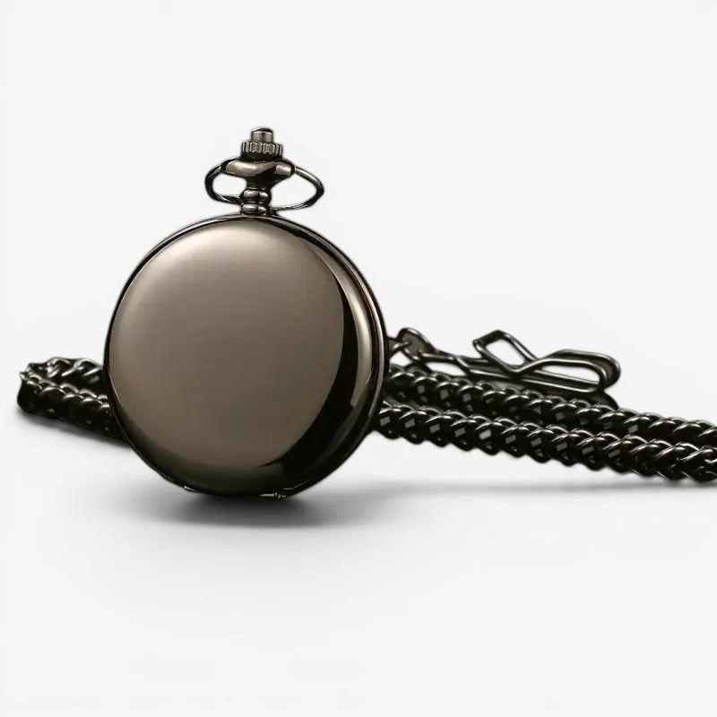 A sleek matte black dial mechanical pocket watch with a polished face and ornate winding crown