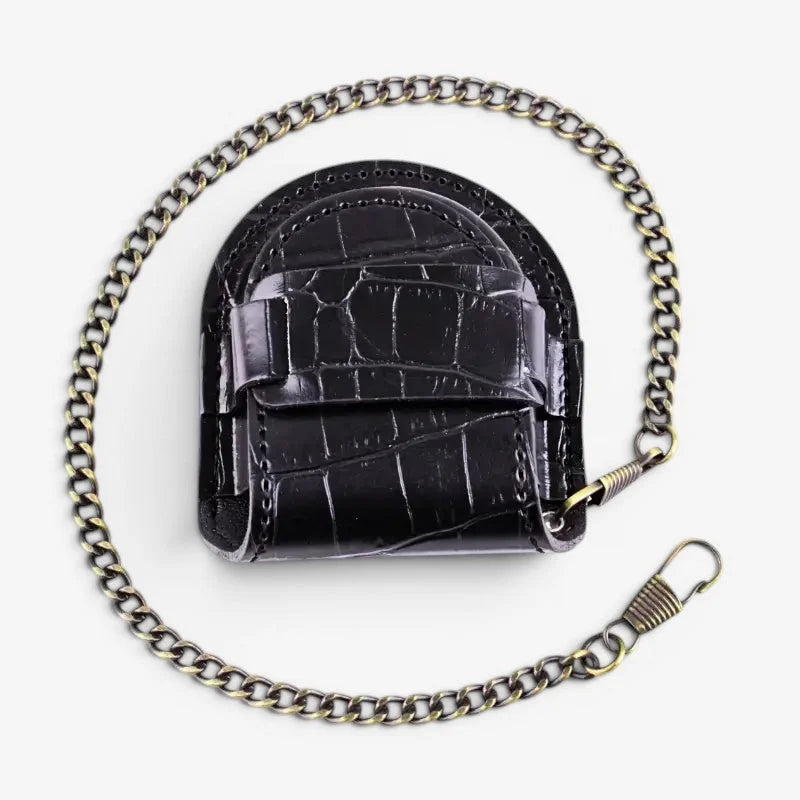 Black leather pocket watch case with crocodile embossing and a metallic link strap for secure carrying