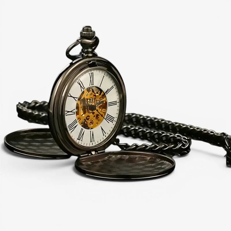 Black mechanical pocket watch with gold-toned movement, roman numerals, white face, and ornate black chain