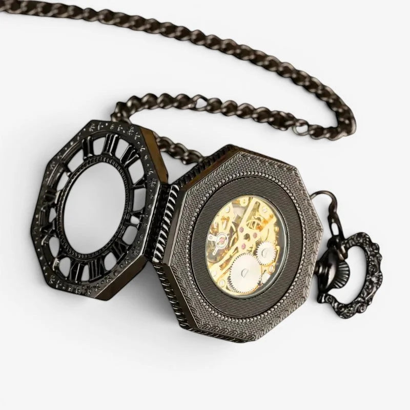 Black steampunk pocket watch with black octagonal case, intricate engravings, and golden mechanical movement visible inside