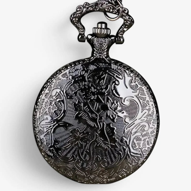 Antique-style black wolf motif pocket watch with intricate engraved floral and scrollwork design on circular face