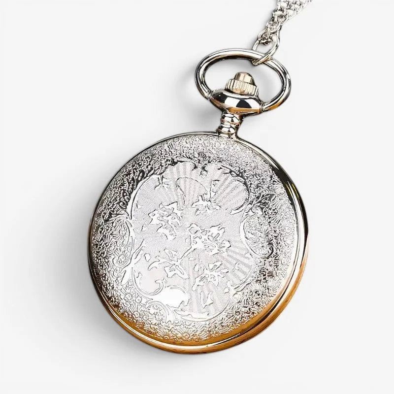 Blue flower pocket watch silver and gold-toned with intricate floral engraving and delicate chain attached