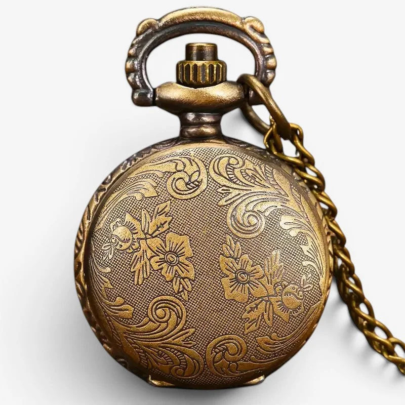 Antique brass blue owl pocket watch with intricate floral and scroll engraving attached to matching chain