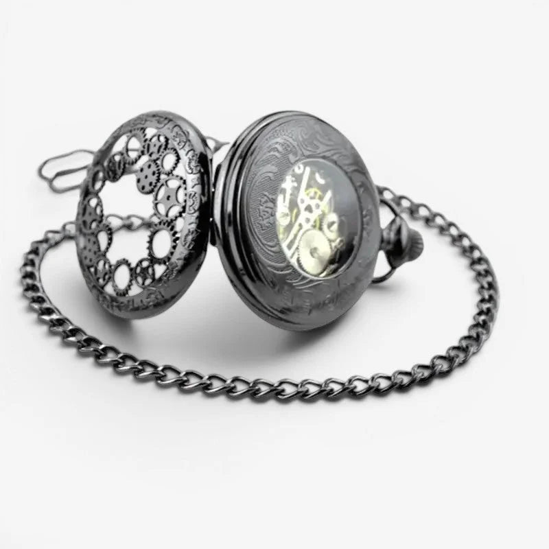 Blue pocket watch featuring a black ornate lid with intricate gears and a visible golden mechanical movement inside