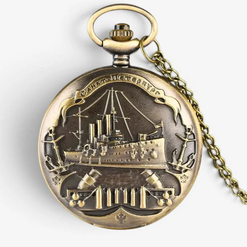 Antique brass-colored boat pocket watch with intricate naval battle ship engraving and anchor motifs on back side