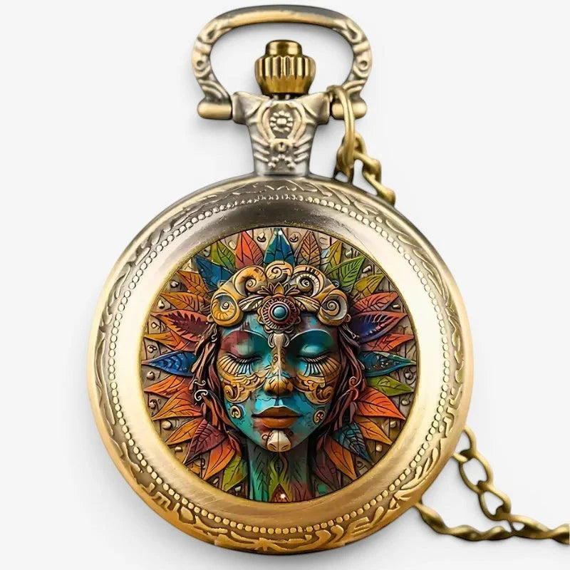 Golden boho pocket watch with ornate colorful face featuring a stylized mask and vibrant feather patterns
