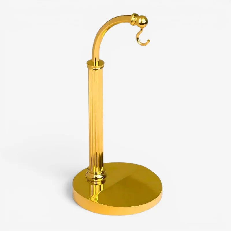 Brass pocket watch stand with golden metallic hook, polished reflective finish, and fluted column design