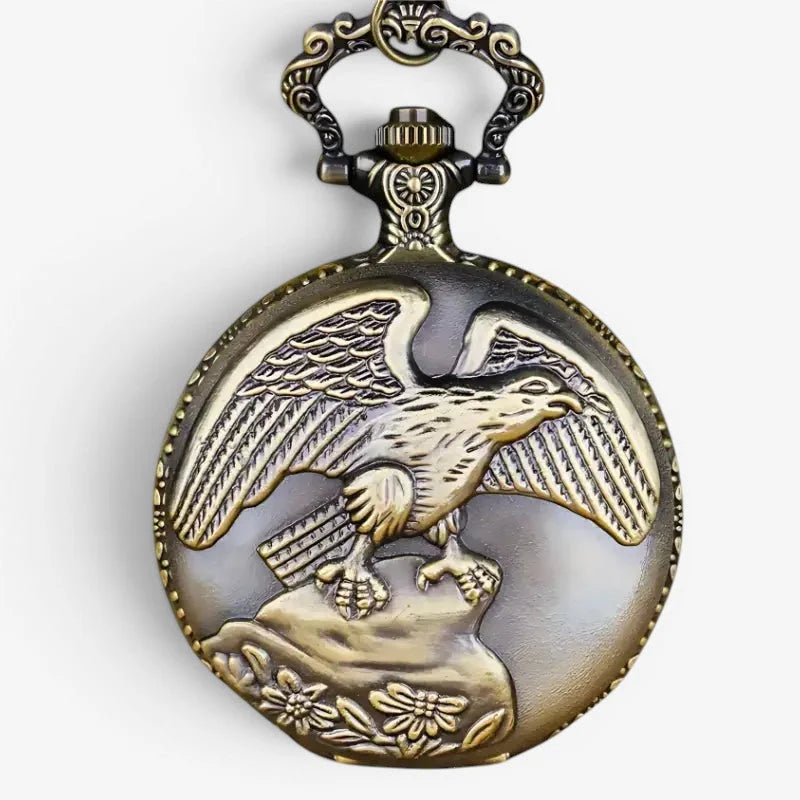 Antique brass-colored bronze eagle pocket watch with intricate eagle engraving and floral motifs on the back side