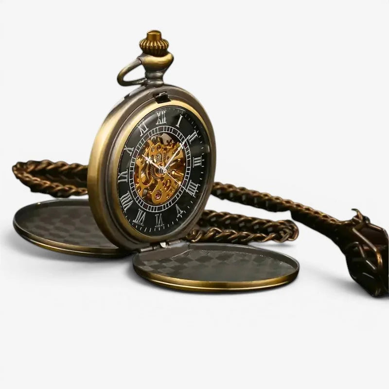 Bronze mechanical pocket watch with antique brass finish, visible internal gears, roman numerals, and ornate chain