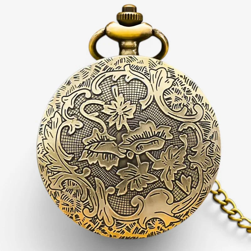 Antique bronze steampunk pocket watch with intricate floral and vine brass engraving and decorative winding crown