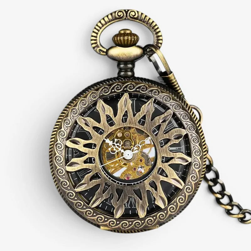 Bronze sun pocket watch in antique brass with intricate sunburst design and visible mechanical gears