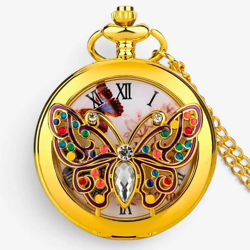 Golden butterfly pocket watch with colorful gemstone butterfly design and roman numerals on the face