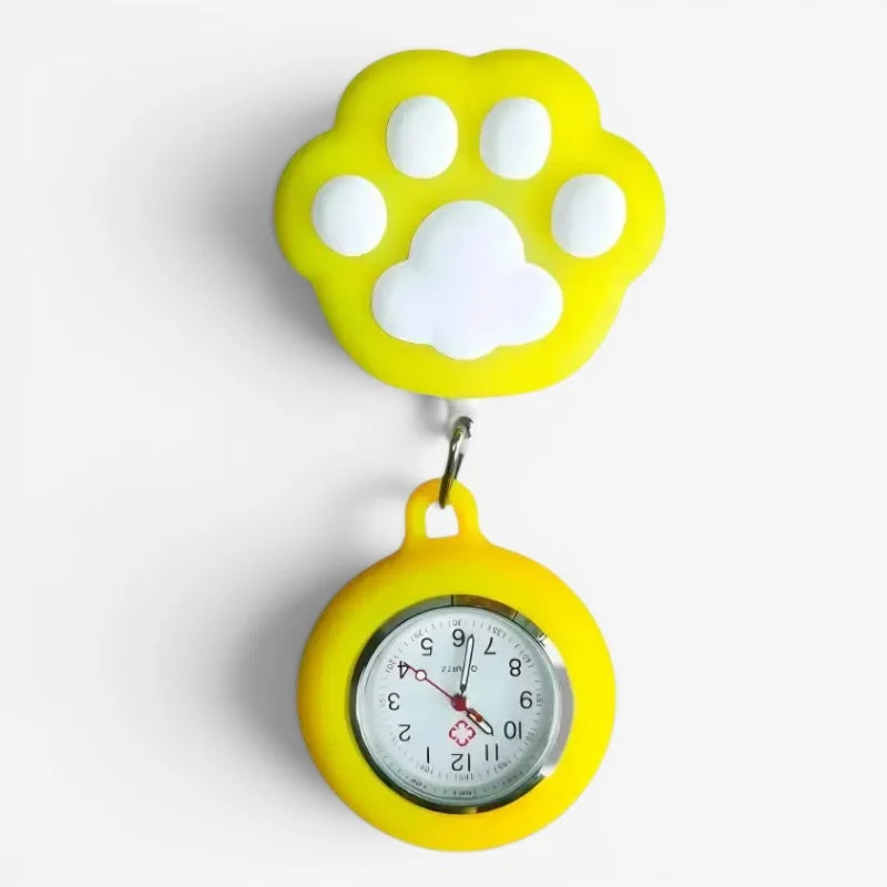 Cat nurse watch featuring bright yellow silicone paw print clip with matching circular watch face and red hands