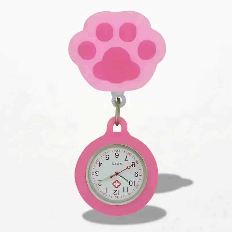 Pink silicone paw-print clip-on cat nurse watch with round face and medical cross emblem for healthcare use