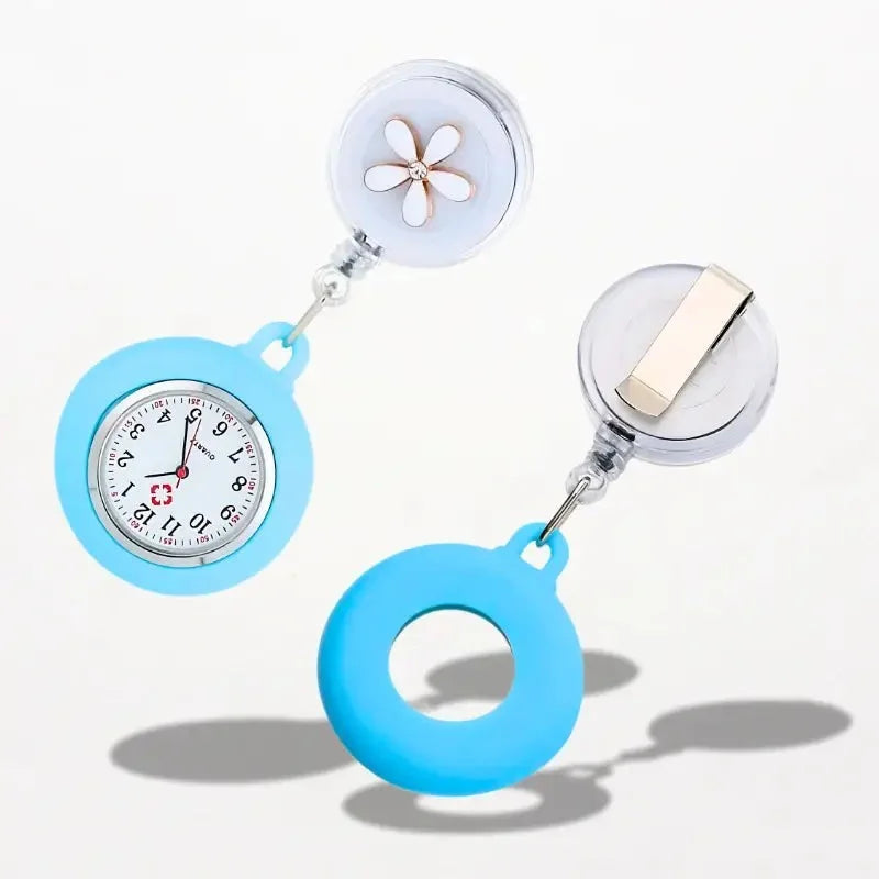 Light blue silicone-coated retractable badge holder with clear plastic clip and white flower accent for nurse watch