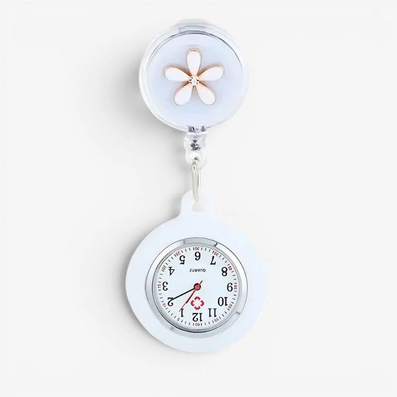 Clip on nurse watch with white band, clear floral charm, and silver-toned face featuring red hands