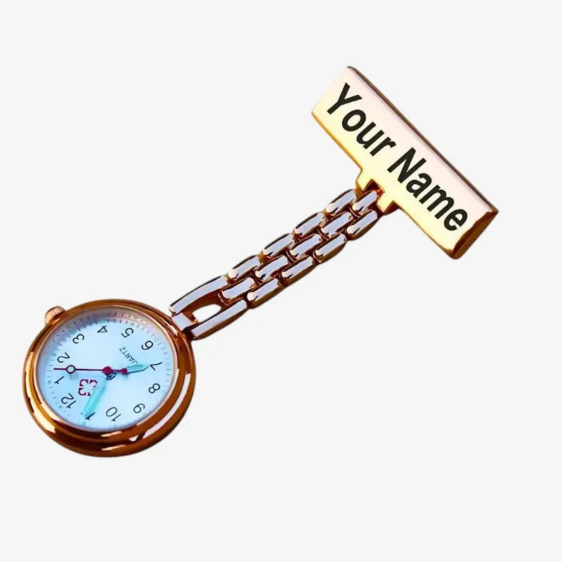 Customizable gold-toned nurse watch with light blue face and engraved nameplate for healthcare professionals