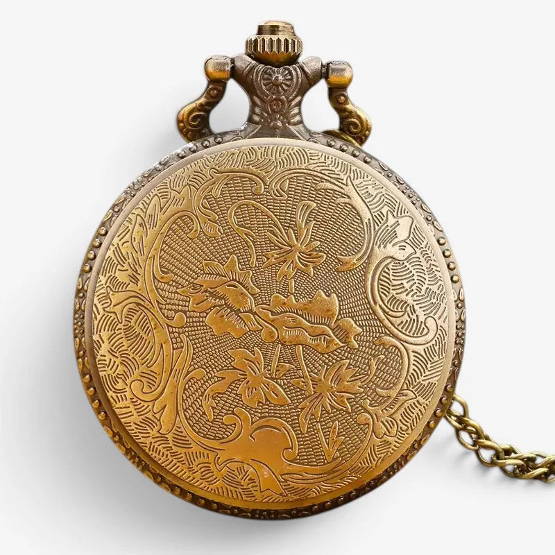 Antique style brass dad pocket watch with intricate floral engravings and a decorative crown
