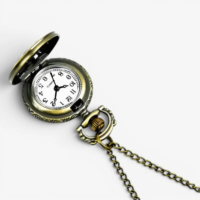 Antique brass-finished deer motif pocket watch with white face, black numerals and hands attached to ornate chain