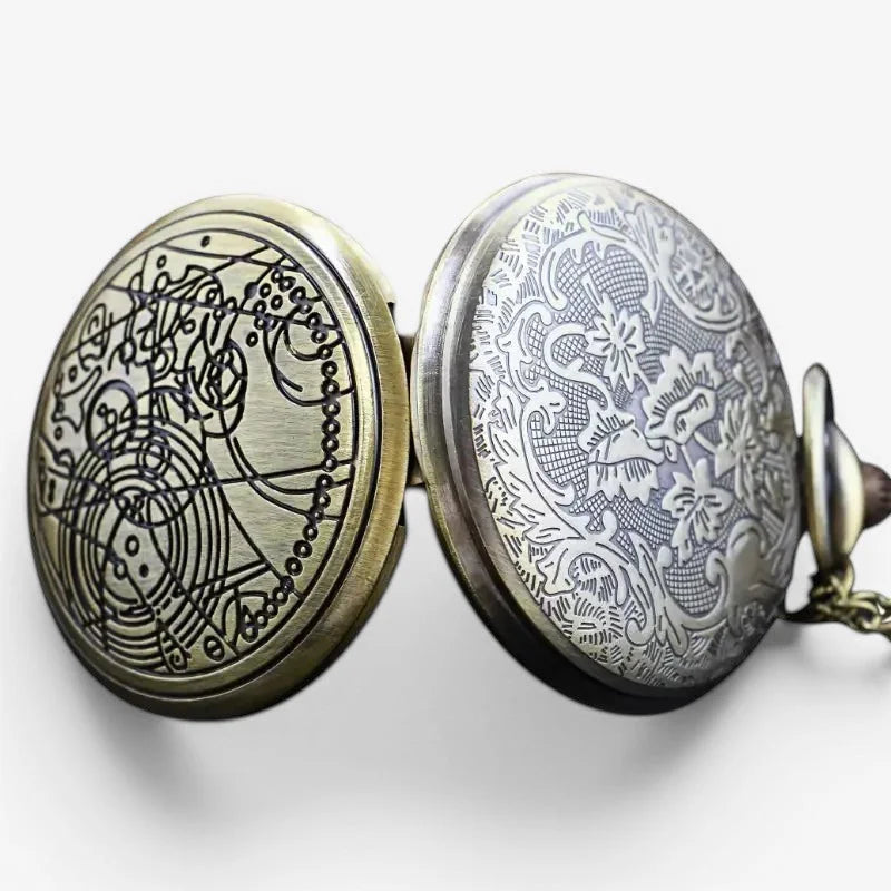 Antique brass finished doctor who pocket watch with intricate engraved mechanical design on front and floral motifs on back