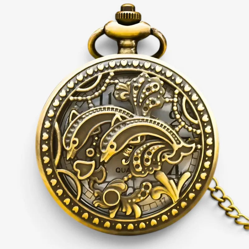 Antique gold-toned dolphin pocket watch with intricate floral filigree design and decorative chain