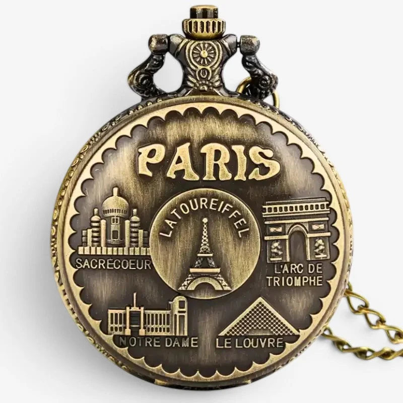 Antique brass-colored Eiffel Tower pocket watch with engraved Paris landmarks including Eiffel Tower and Notre Dame